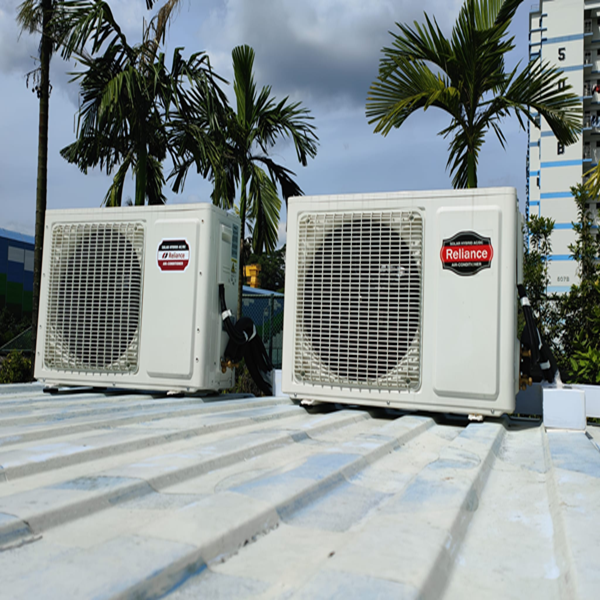 Technician installing solar panels on a roof